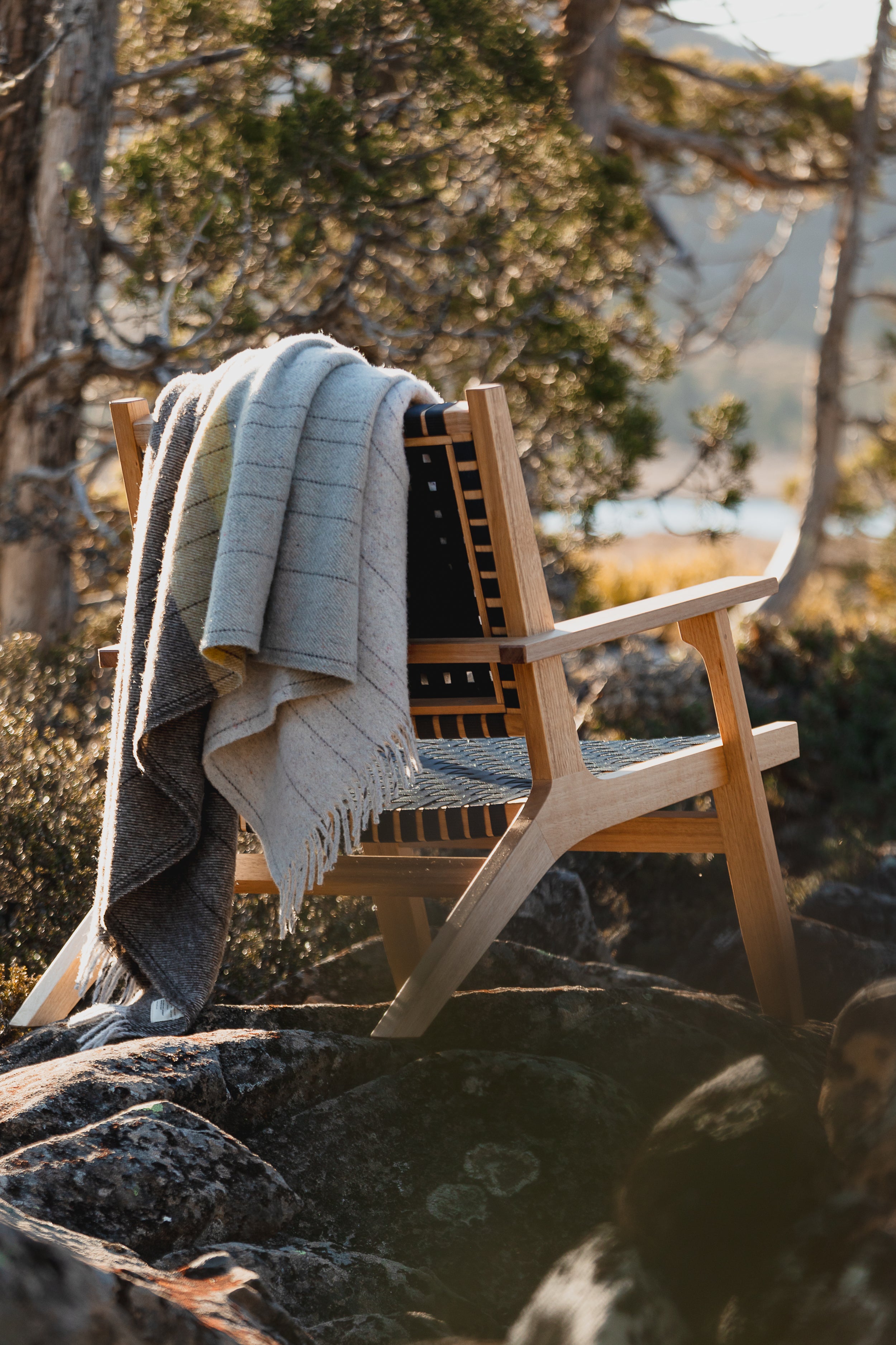 The Cradle Mountain throw over the back of a chair in the rocky central plateau. 