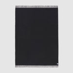 Full view of essential throw in solid charcoal black.
