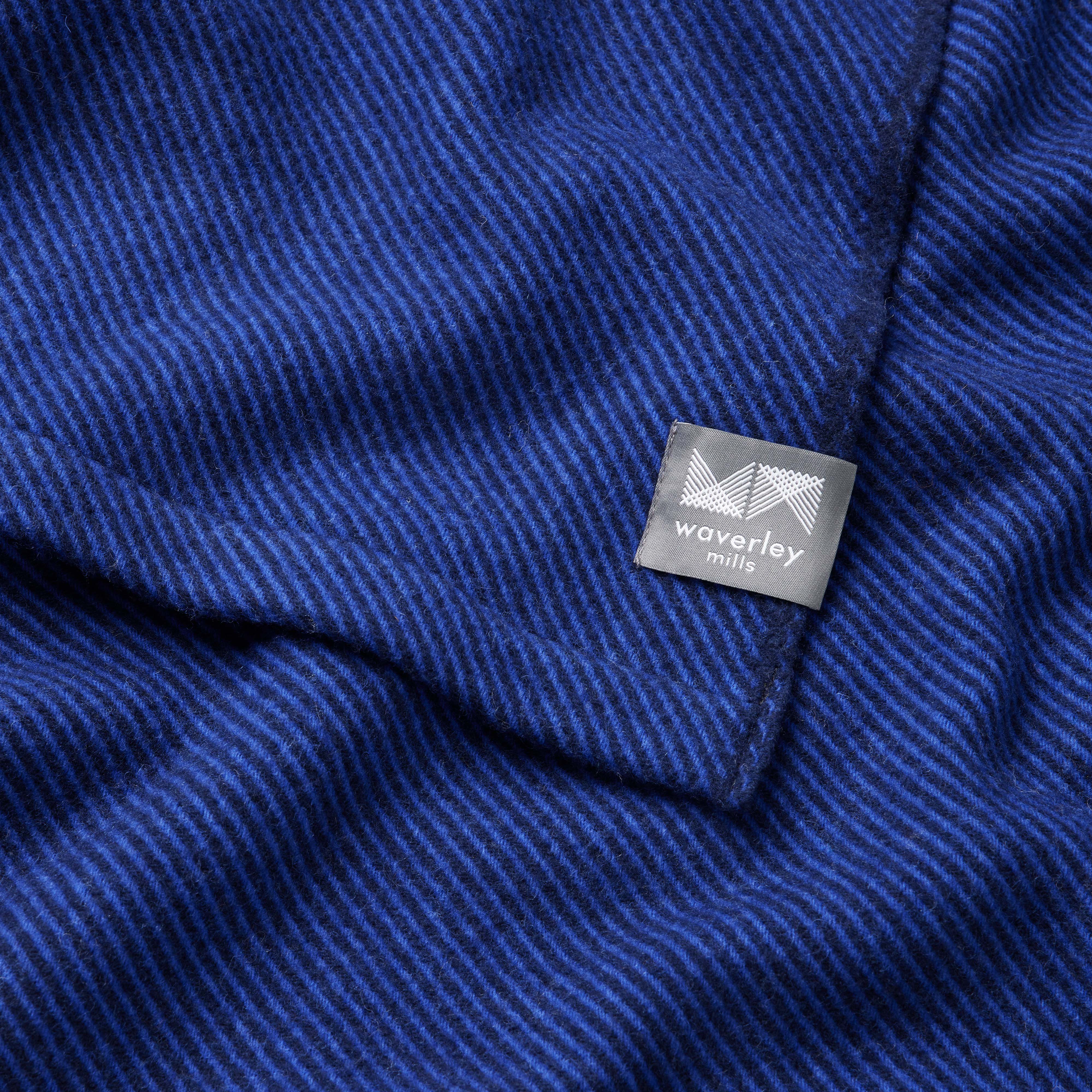 Close up of merino wool flint blanket in cobalt and navy twill.
