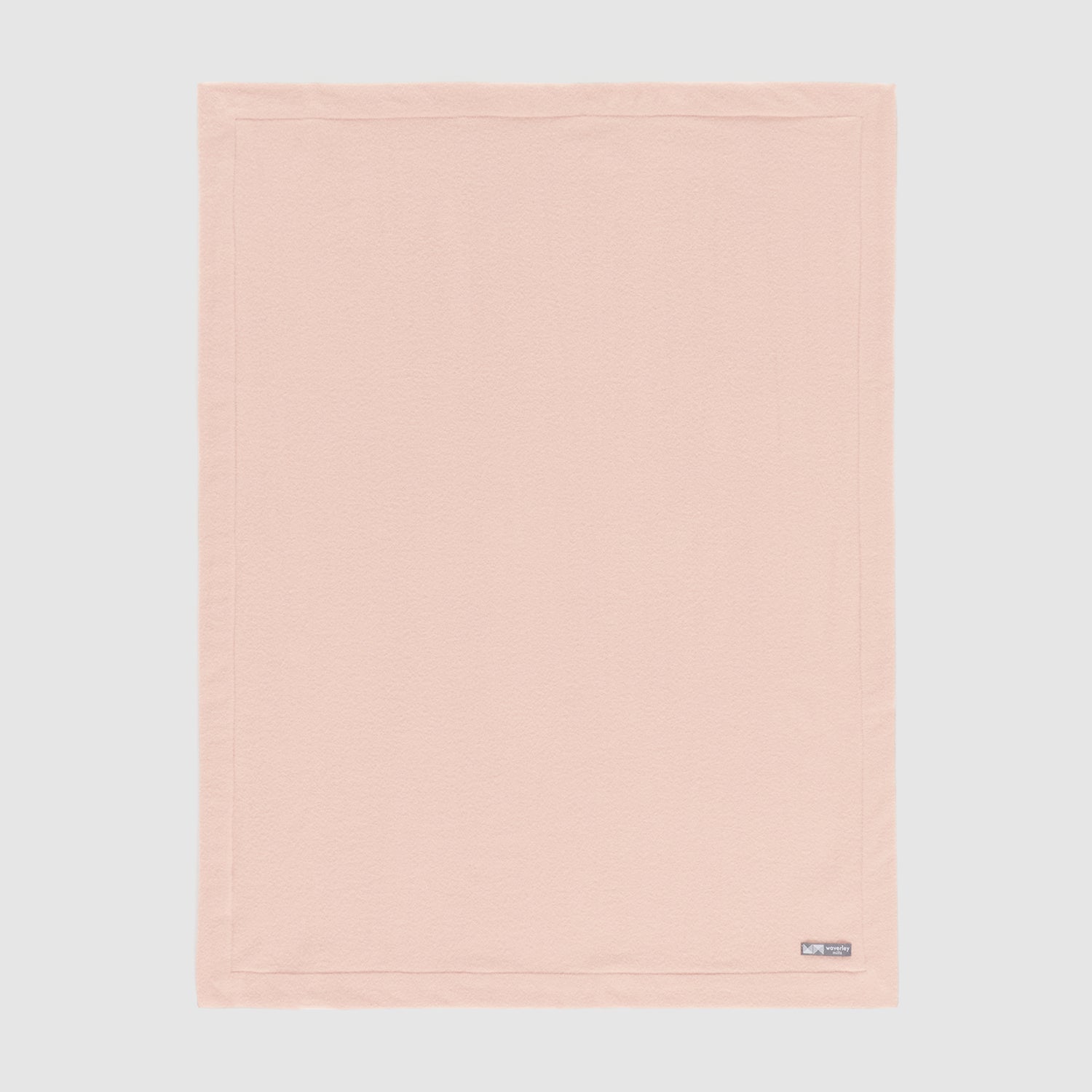 Full view of pure merino wool baby blanket in cameo rose.