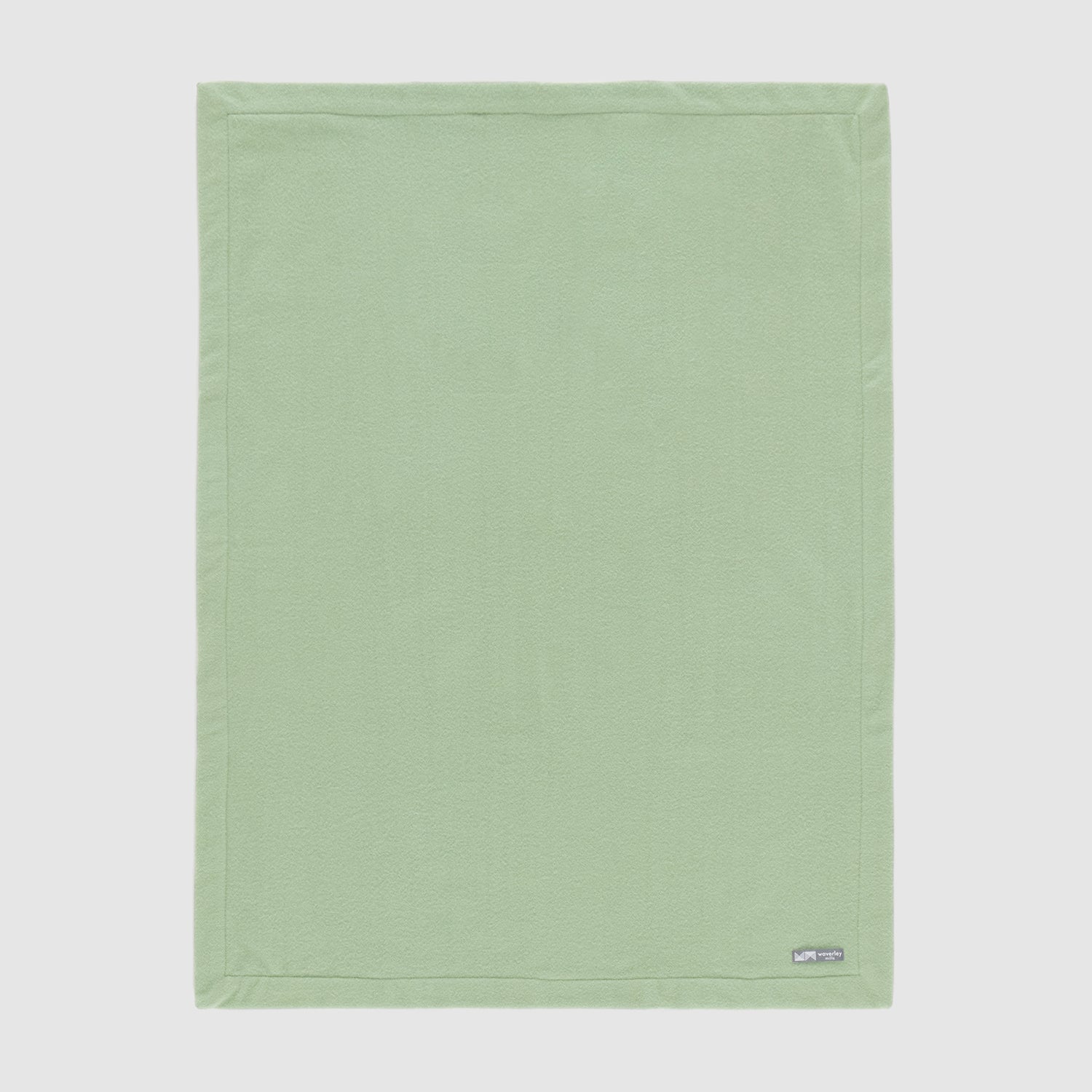 Full view of merino wool baby blanket nest in mistletoe green.
