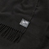 Close up of essential throw in solid charcoal black.