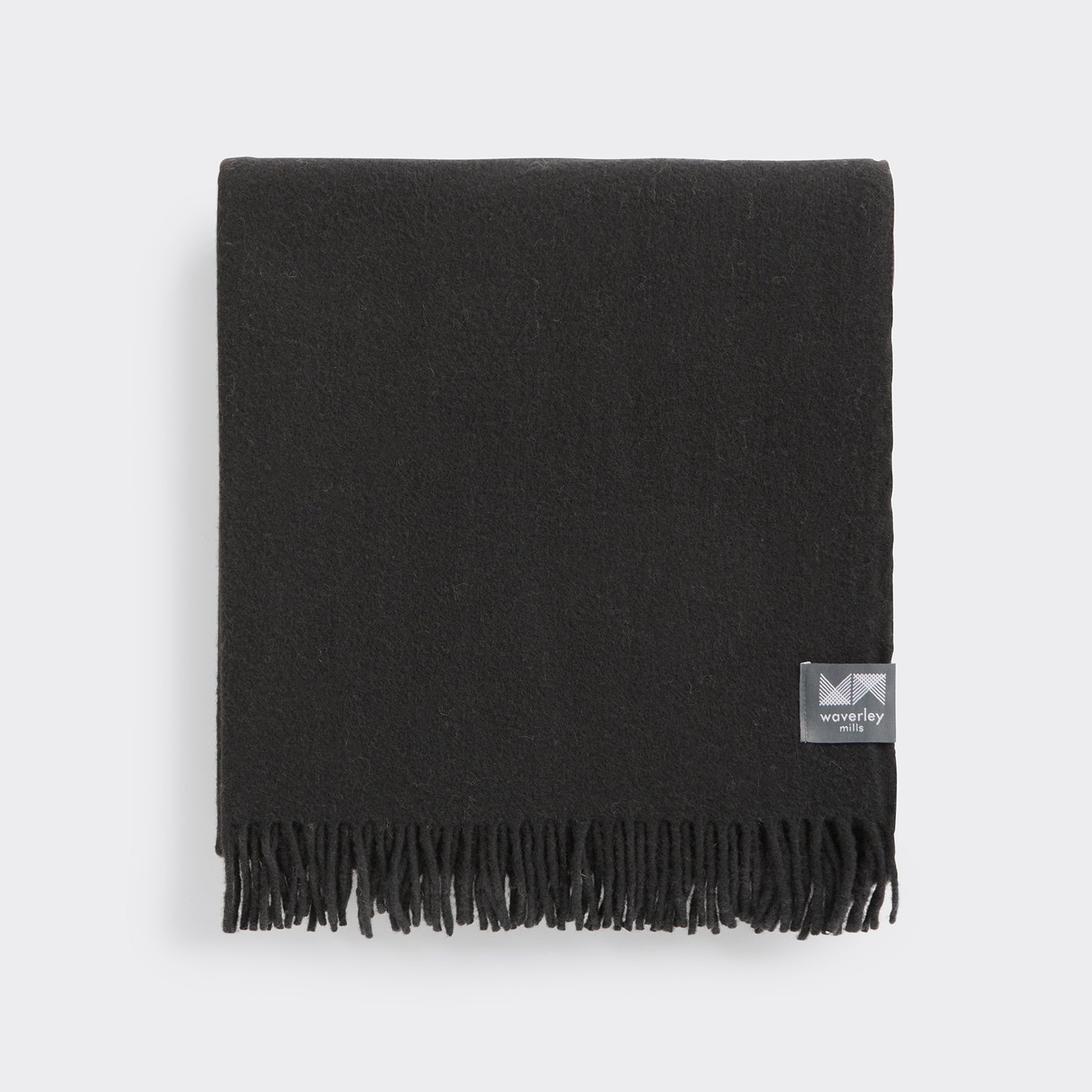 Folded essential throw in charcoal black.