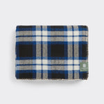 Folded Midnight Check throw in cobalt and black.