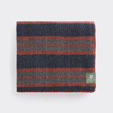 Folded River travel rug in ginger.