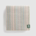A folded jewel ranger stripe blanket.