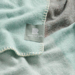 A close up of the chequer blanket in mint.