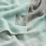 A close up of the chequer blanket in mint.