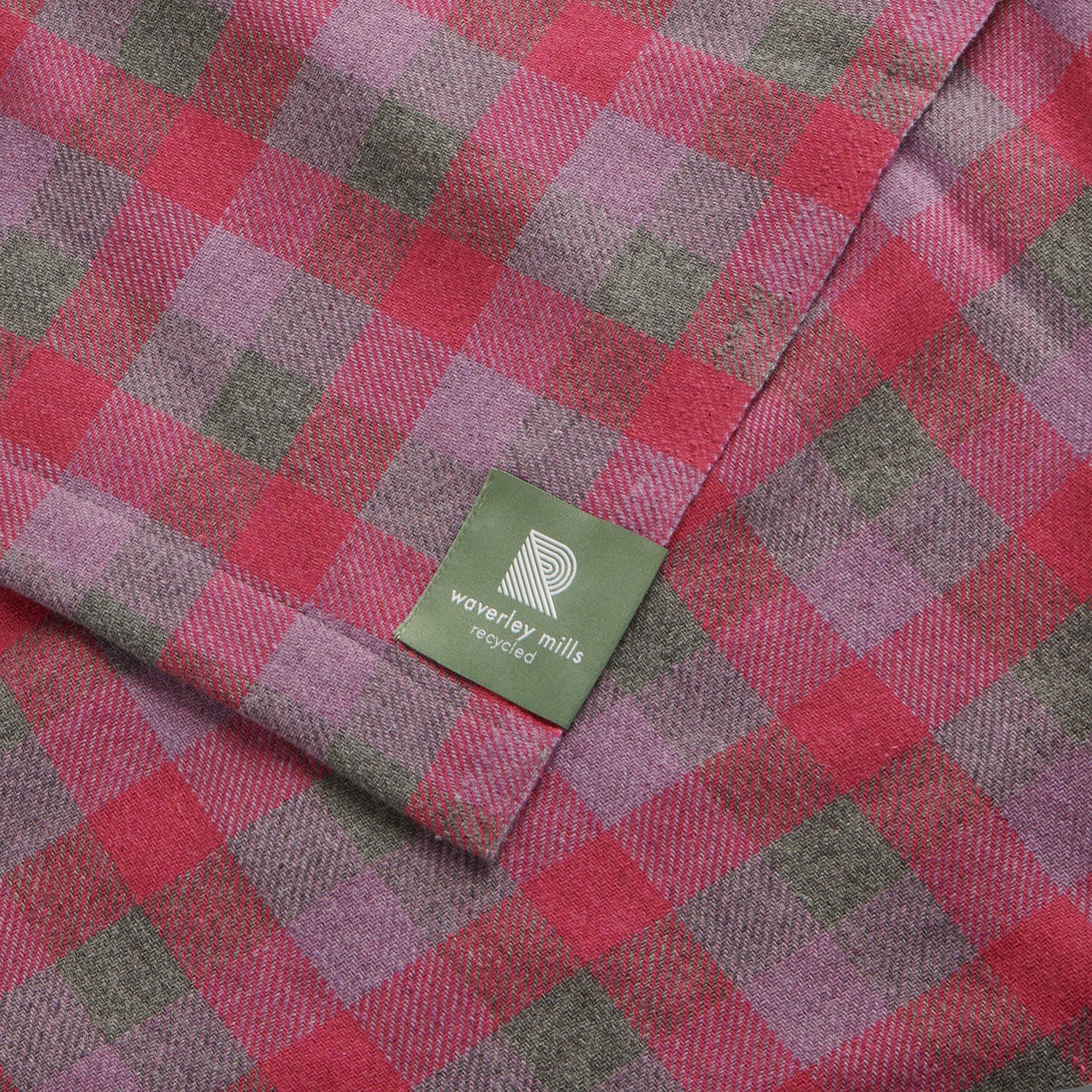 Close up of a lightweight throw in rose check.
