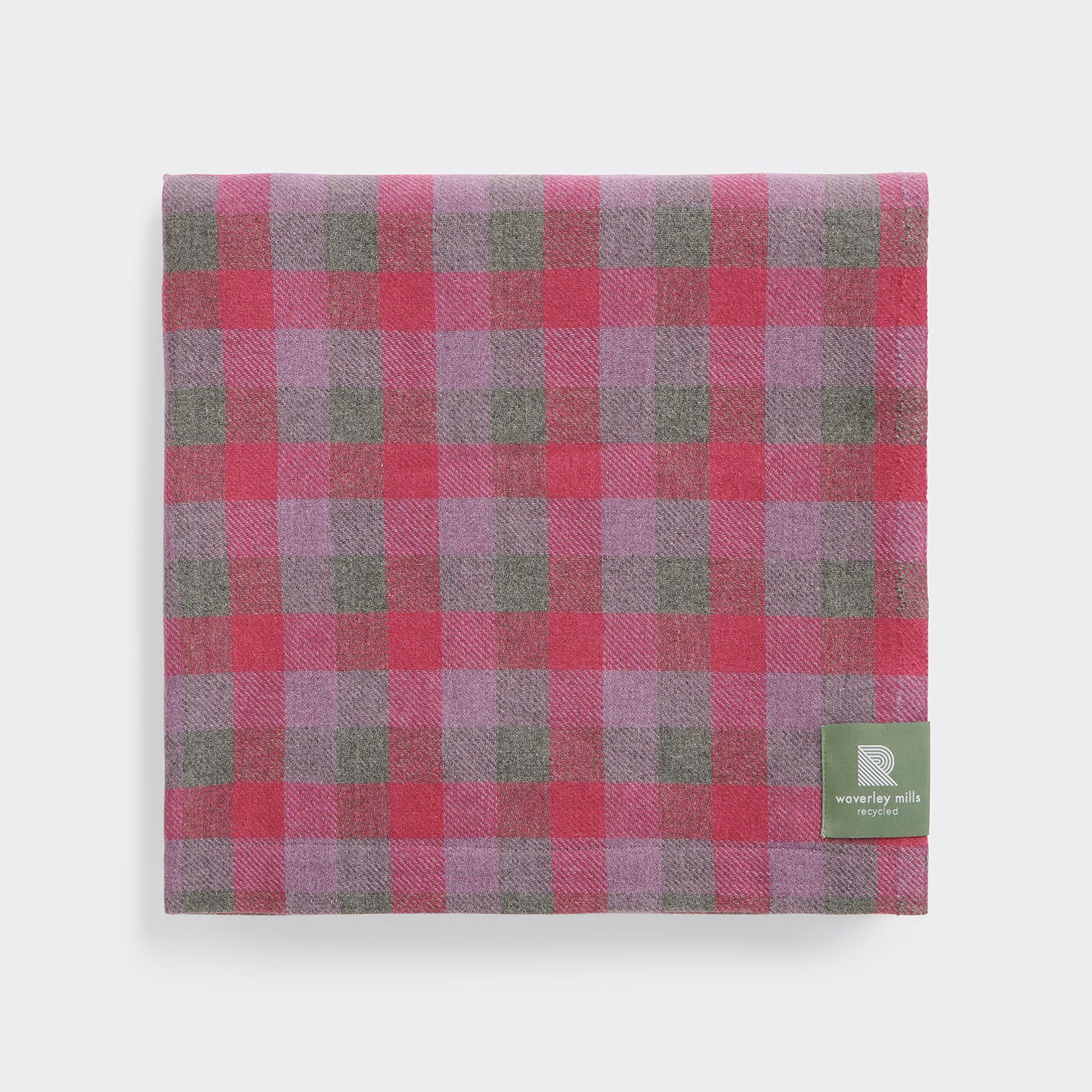 Folded lightweight throw in rose check.