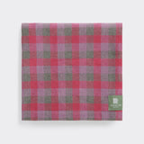 Folded lightweight throw in rose check.