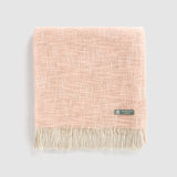 A folded pink shawl.