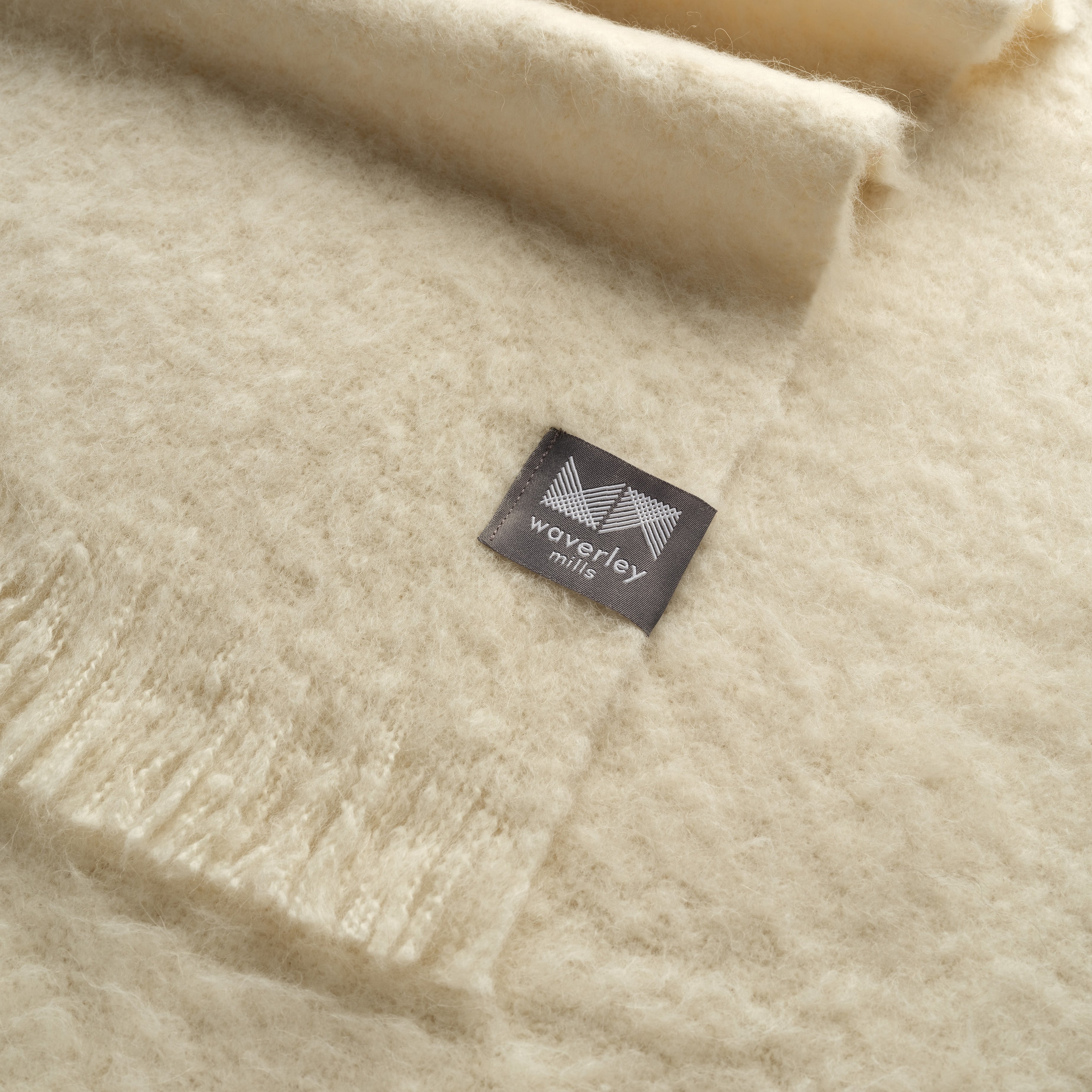 Close up of the natural alpaca throw showing the soft texture.