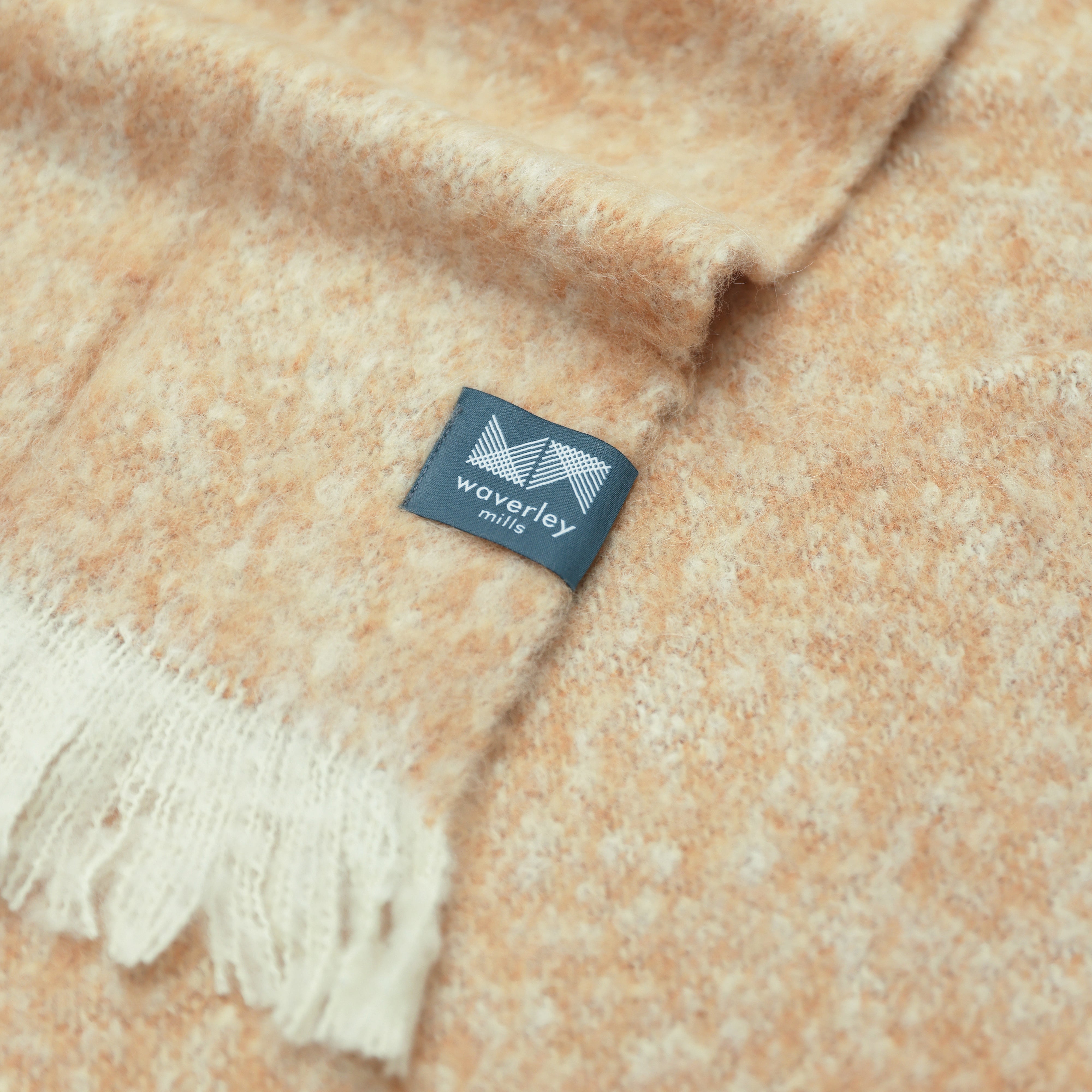 Close up of almond alpaca throw showing the subtle colour texture.