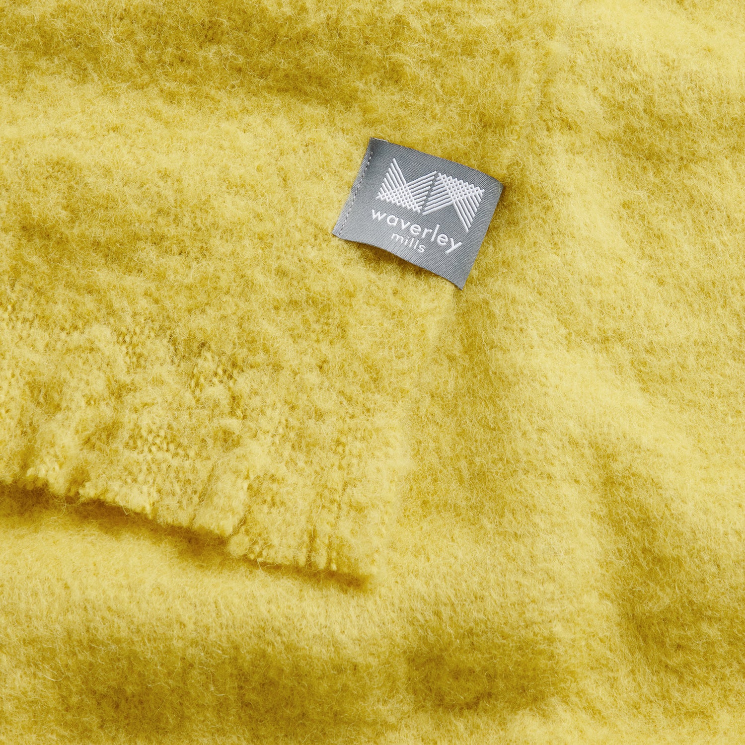 Close up of chroma throw in citrine showing soft texture.