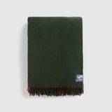 Folded gem throw in forest.