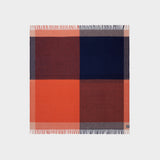 Full view of graze picnic rug showing bold geometric pattern in orange and navy.