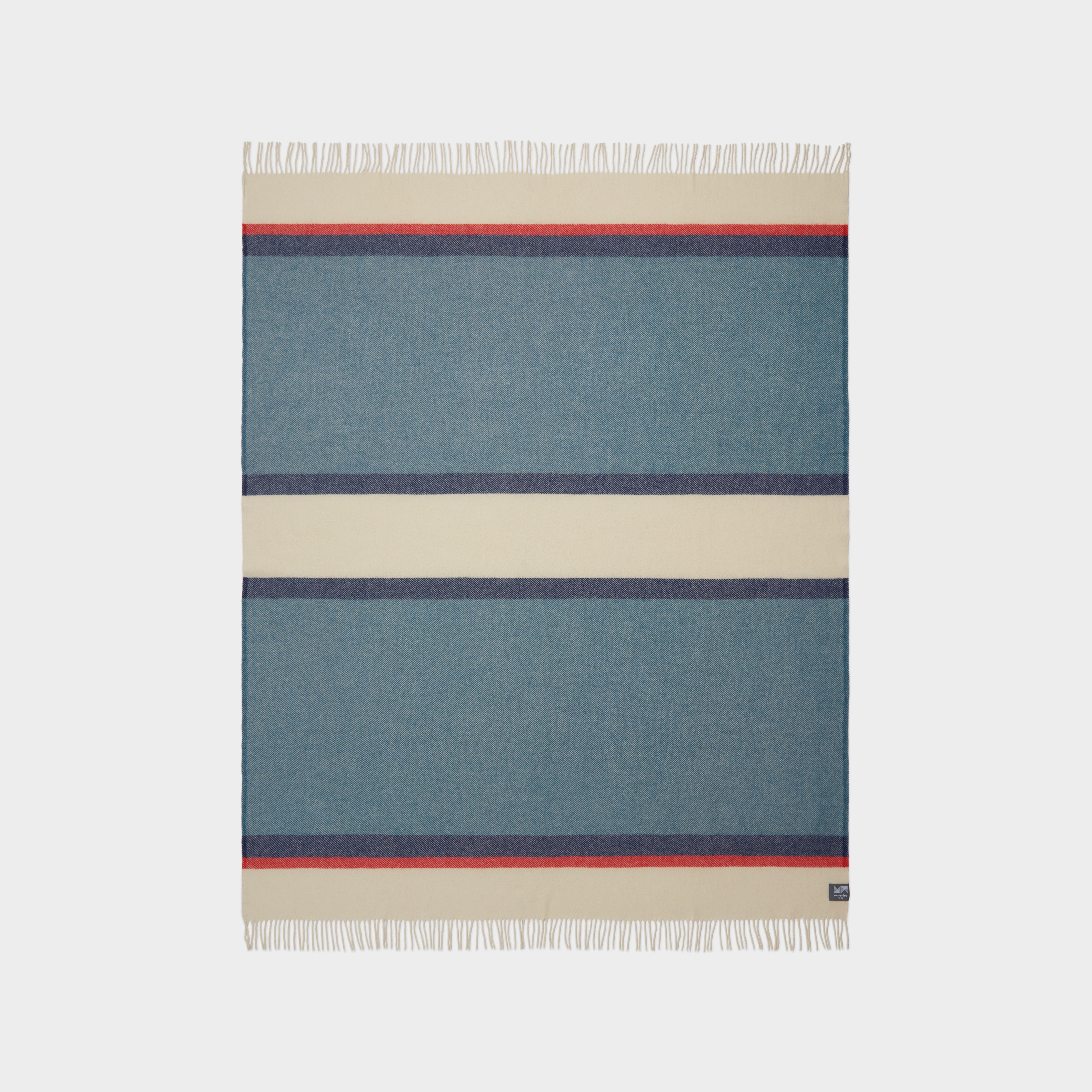 Full view of Riviera Throw in Mari, showing pattern of stripes of blue, natural, and red.