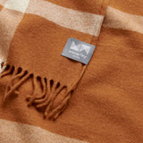 Close up of Ravine throw in terracotta.