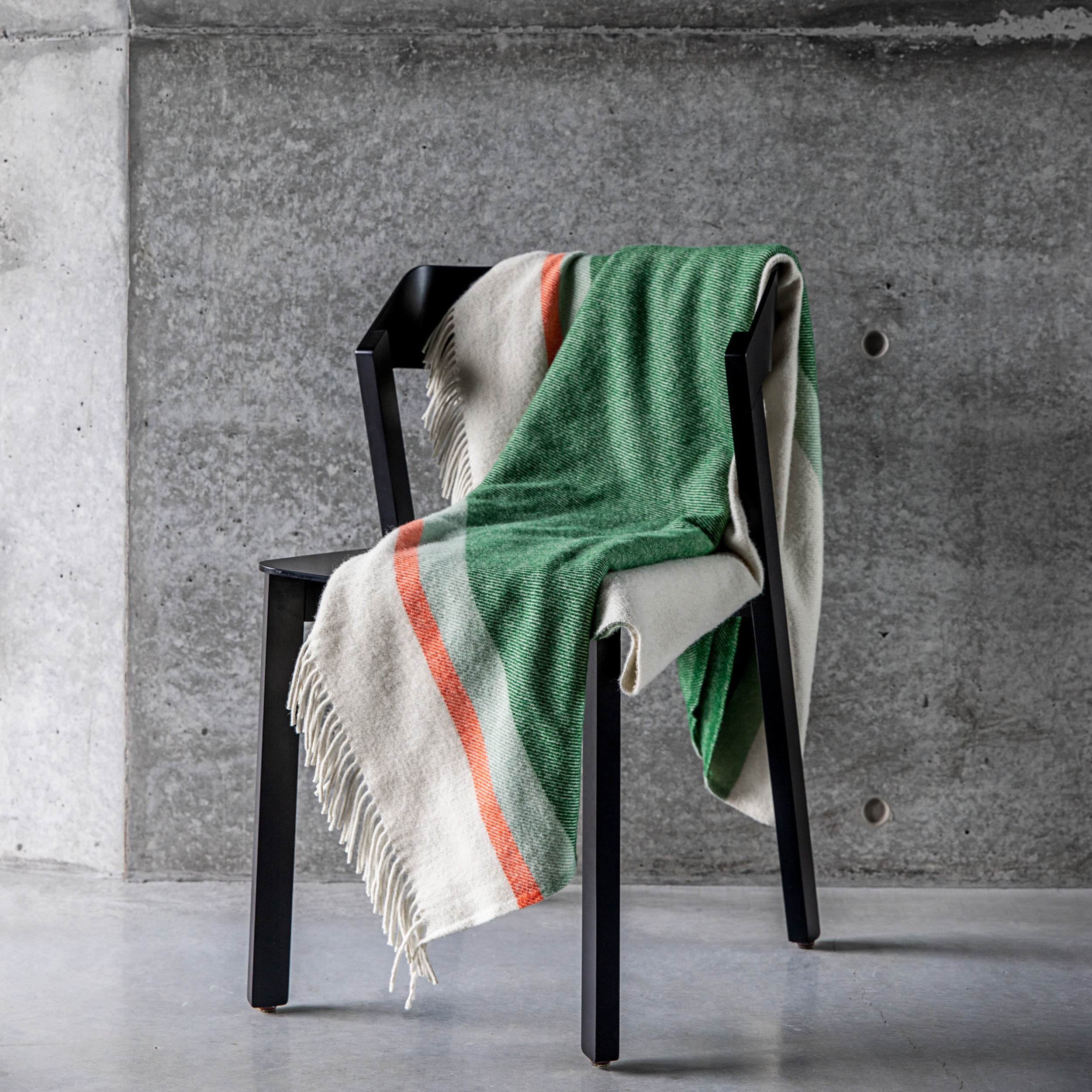 Riviera throw in mint draped over a chair.