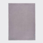 Full view of grey baby blanket.