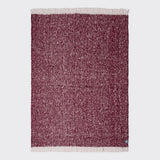 Full view of burgundy alpaca throw. 