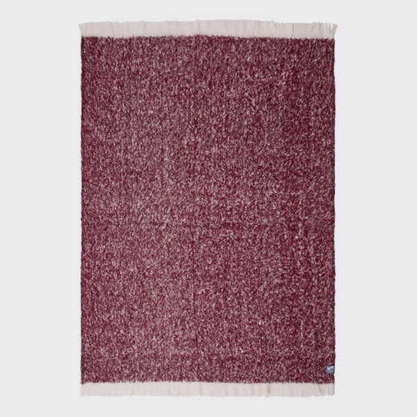 Full view of burgundy alpaca throw. 