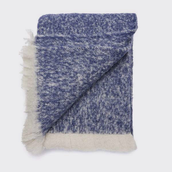 Folded navy alpaca throw showing the texture and colour variation.