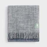Folded midnight boucle throw.