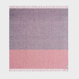 Full view of twisted tonal throw in blue and red.