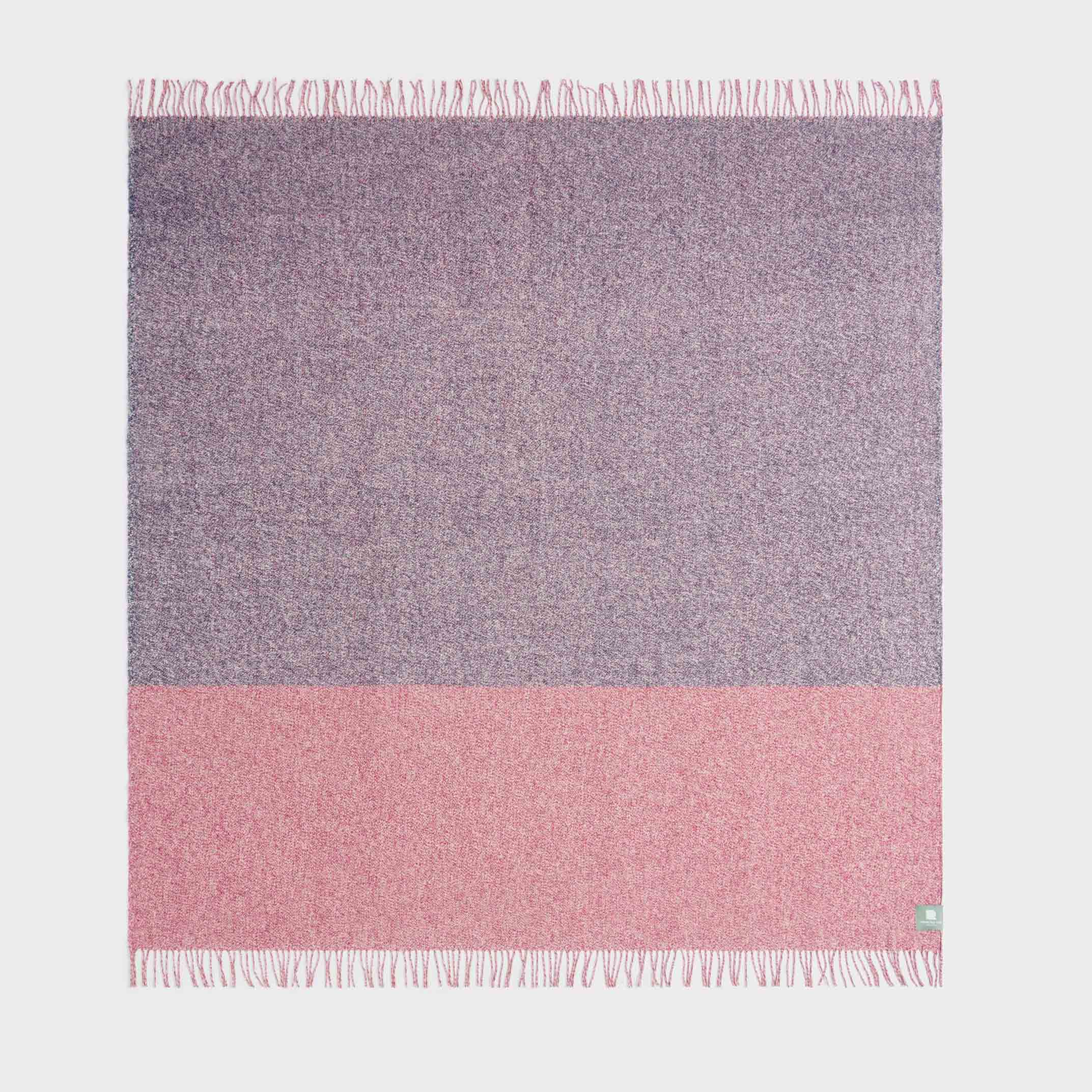 Full view of twisted tonal throw in blue and red.