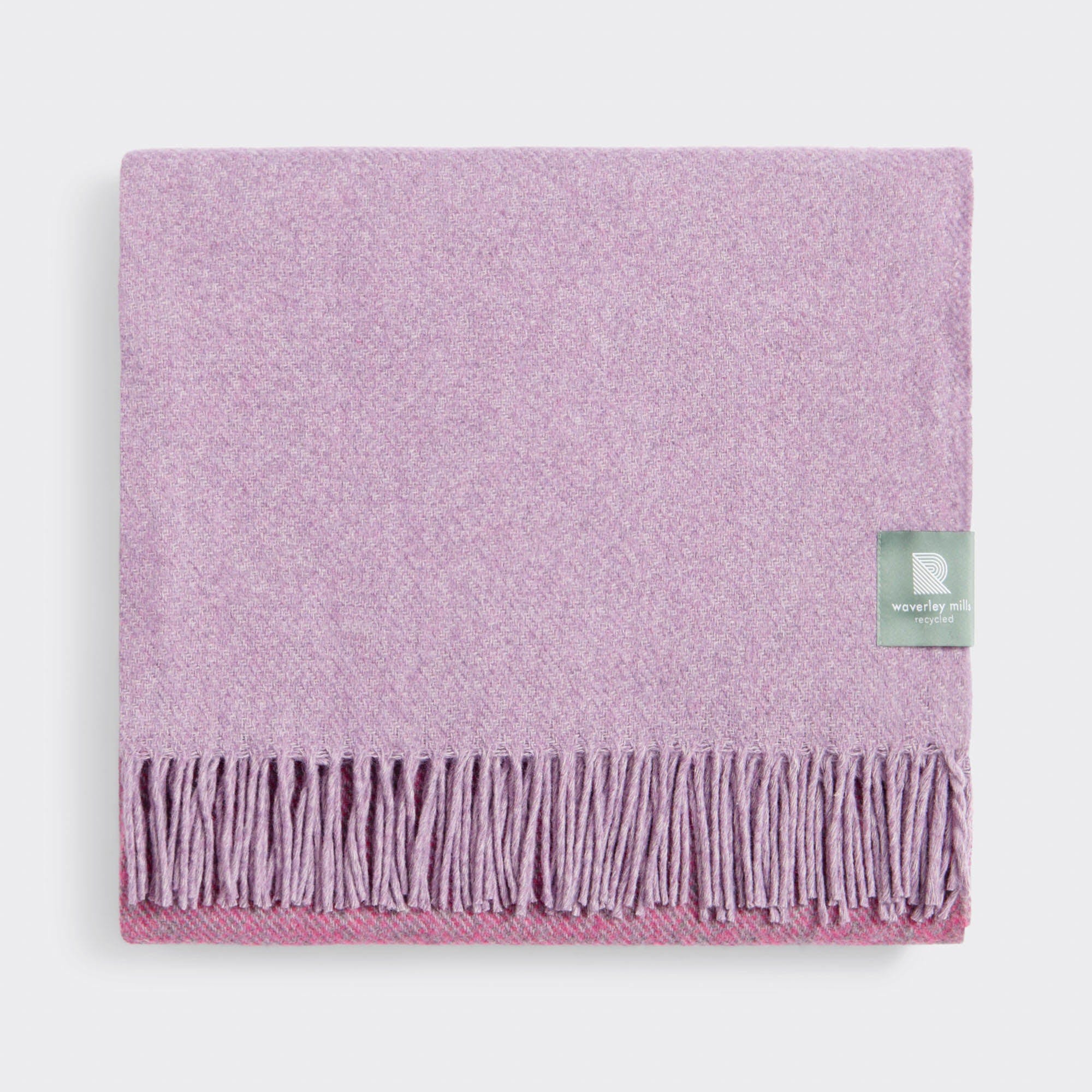 Folded tonal twisted throw in pink.
