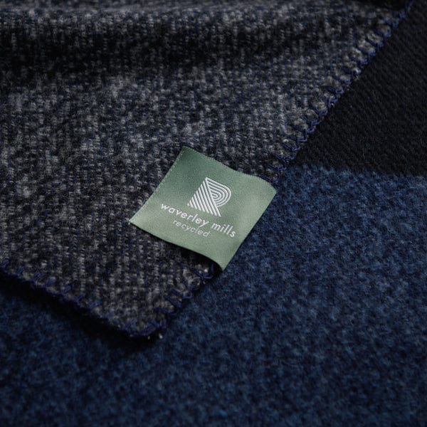 Close up of Nox Tonal throw in black, blue and grey.